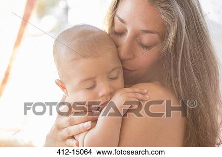 Picture - Mother holding baby boy. Fotosearch