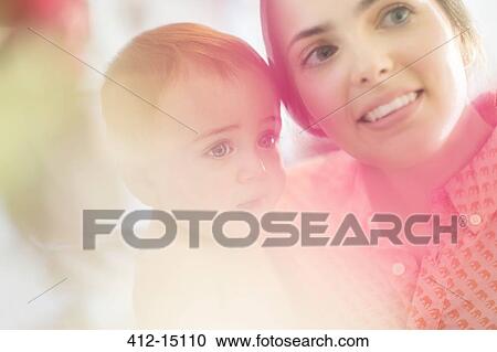 Stock Image - Mother holding baby boy. Fotosearch