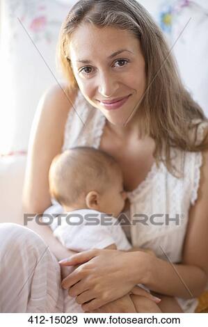 Mother holding baby boy View Large Photo Image Stock Photo - Mother holding baby boy. Fotosearch