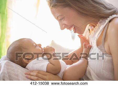 Mother holding baby boy View Large Photo Image Stock Photo - Mother holding baby boy. Fotosearch