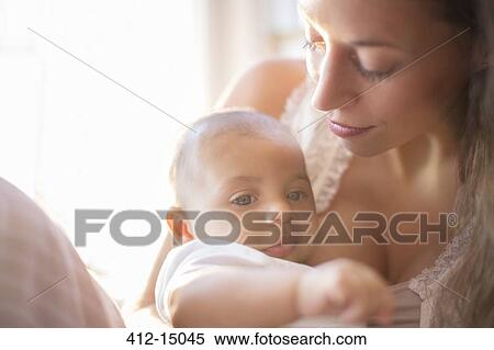 Mother holding baby boy View Large Photo Image Stock Photography - Mother holding baby boy. Fotosearch