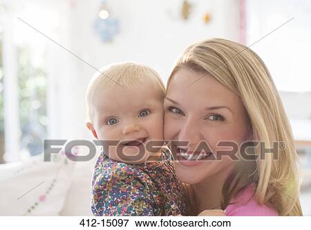 Mother holding baby girl View Large Photo Image Stock Photo - Mother holding baby girl. Fotosearch