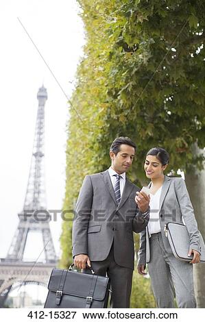 Business people talking near Eiffel Tower, Paris, France View Large Photo Image Stock Photo - Business people talking near Eiffel Tower, Paris, France. Fotosearch