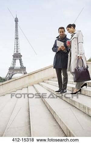 Business people talking on steps near Eiffel Tower, Paris, France View Large Photo Image Stock Photo - Business people talking on steps near Eiffel Tower, Paris, France. Fotosearch
