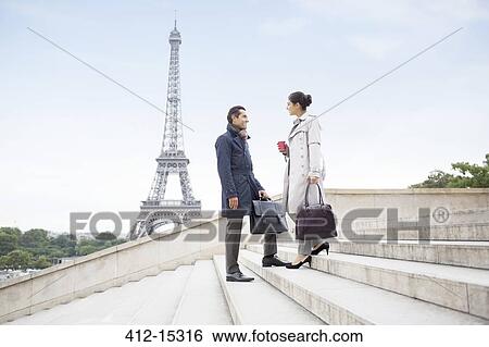 Business people talking on steps near Eiffel Tower, Paris, France View Large Photo Image Stock Photograph - Business people talking on steps near Eiffel Tower, Paris, France. Fotosearch