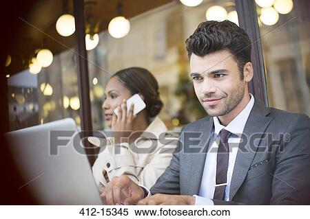 Business people working at sidewalk cafe View Large Photo Image Stock Photography - Business people working at sidewalk cafe. Fotosearch