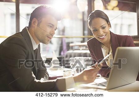 Business people working in restaurant View Large Photo Image Stock Photo - Business people working in restaurant. Fotosearch