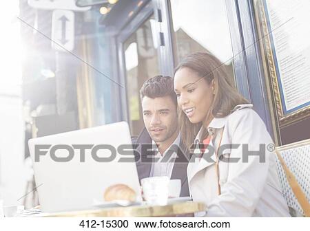 Business people working in sidewalk cafe View Large Photo Image Stock Image - Business people working in sidewalk cafe. Fotosearch