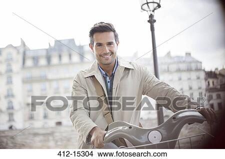 Picture - Businessman on bicycle, Paris, France. Fotosearch