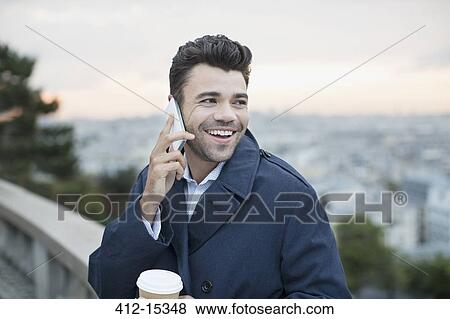 Businessman on cell phone outdoors View Large Photo Image Stock Photo - Businessman on cell phone outdoors. Fotosearch