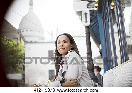 Businesswoman sitting at sidewalk cafe near Sacre Coeur Basilica, Paris, France View Large Photo Image Stock Photo - Businesswoman sitting at sidewalk cafe near Sacre Coeur Basilica, Paris, France. Fotosearch