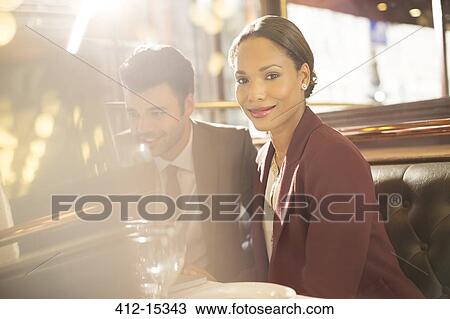 Businesswoman smiling in restaurant View Large Photo Image Stock Image - Businesswoman smiling in restaurant. Fotosearch