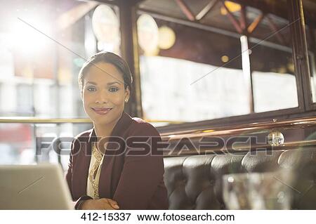 Businesswoman smiling in restaurant View Large Photo Image Stock Photo - Businesswoman smiling in restaurant. Fotosearch