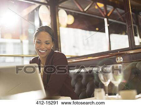 Businesswoman working in restaurant View Large Photo Image Stock Image - Businesswoman working in restaurant. Fotosearch