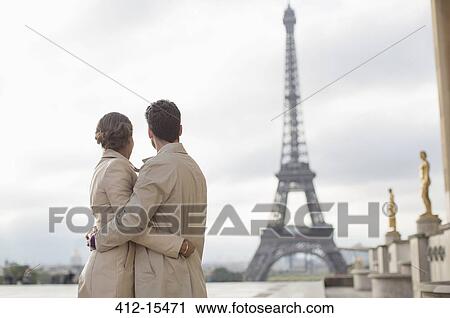 Couple admiring Eiffel Tower, Paris, France View Large Photo Image Stock Image - Couple admiring Eiffel Tower, Paris, France. Fotosearch