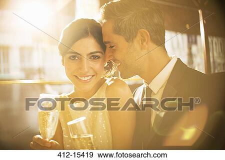 Couple having champagne together View Large Photo Image Stock Photo - Couple having champagne together. Fotosearch