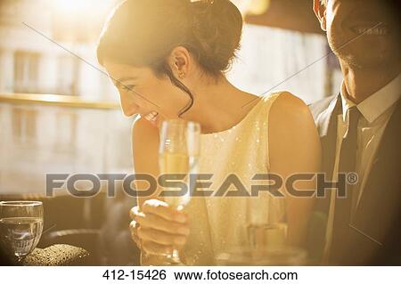 Stock Photograph - Couple having champagne together. Fotosearch