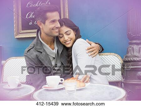 Couple hugging at sidewalk cafe, Paris, France View Large Photo Image Stock Photo - Couple hugging at sidewalk cafe, Paris, France. Fotosearch