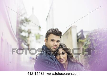 Couple hugging in urban alley View Large Photo Image Stock Image - Couple hugging in urban alley. Fotosearch