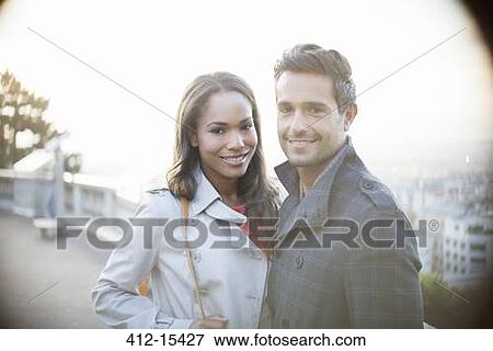 Couple hugging in urban park View Large Photo Image Stock Photo - Couple hugging in urban park. Fotosearch