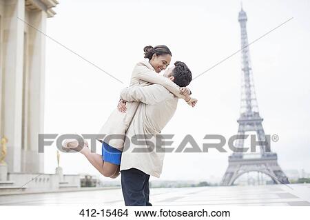 Couple hugging near Eiffel Tower, Paris, France View Large Photo Image Picture - Couple hugging near Eiffel Tower, Paris, France. Fotosearch