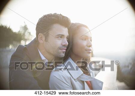 Couple on urban balcony View Large Photo Image Stock Photo - Couple on urban balcony. Fotosearch