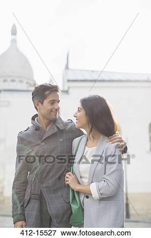 Couple walking together near Sacre Coeur Basilica, Paris, France View Large Photo Image Stock Photo - Couple walking together near Sacre Coeur Basilica, Paris, France. Fotosearch