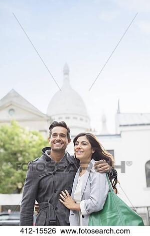 Stock Photograph - Couple walking together near Sacre Coeur Basilica, Paris, France. Fotosearch