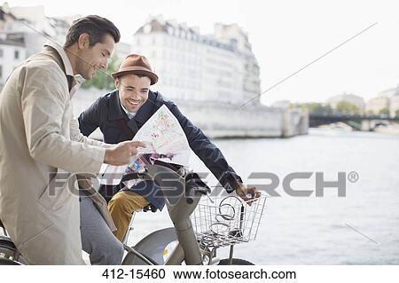 Men looking at map along Seine River, Paris, France View Large Photo Image Stock Image - Men looking at map along Seine River, Paris, France. Fotosearch