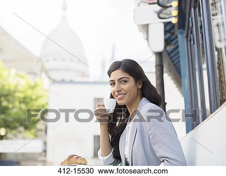 Woman drinking espresso at sidewalk cafe near Sacre Coeur Basilica, Paris, France View Large Photo Image Stock Image - Woman drinking espresso at sidewalk cafe near Sacre Coeur Basilica, Paris, France. Fotosearch