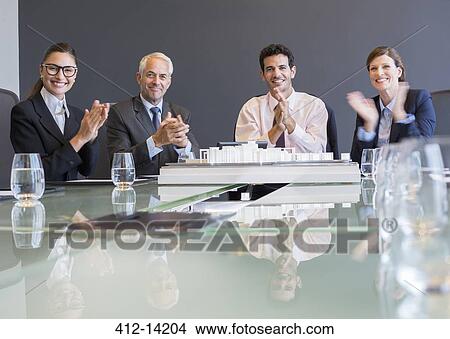Picture - Business people applauding in meeting. Fotosearch