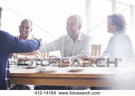 Business people shaking hands in meeting View Large Photo Image Picture - Business people shaking hands in meeting. Fotosearch