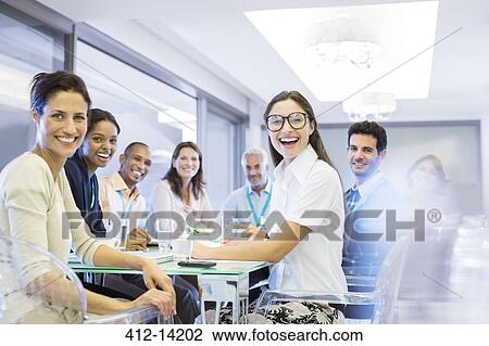 Business people smiling in meeting View Large Photo Image Stock Image - Business people smiling in meeting. Fotosearch