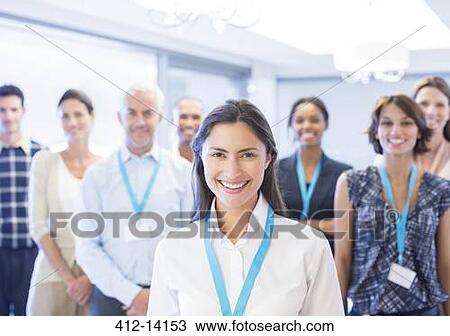 Business people smiling in office View Large Photo Image Stock Image - Business people smiling in office. Fotosearch