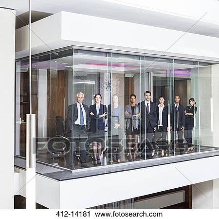 Business people standing at window of modern conference room View Large Photo Image Stock Image - Business people standing at window of modern conference room. Fotosearch