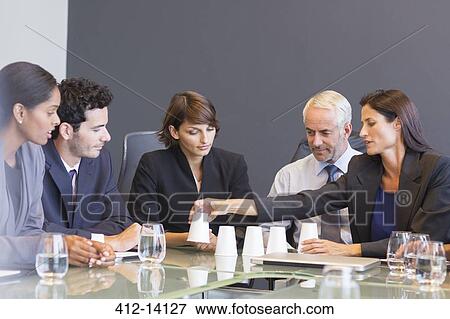 Stock Photo - Business people talking in meeting. Fotosearch