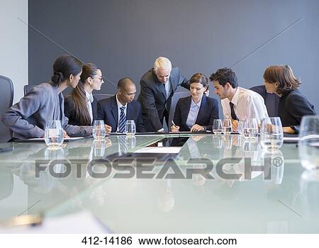 Business people talking in meeting View Large Photo Image Stock Photograph - Business people talking in meeting. Fotosearch