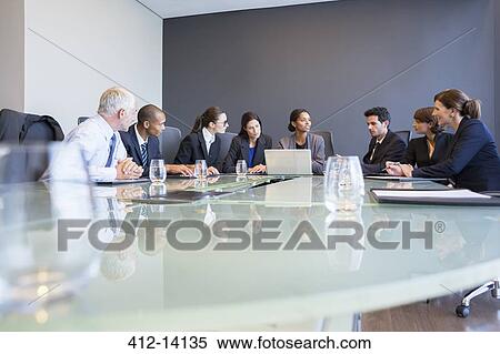 Stock Photography - Business people talking in meeting. Fotosearch