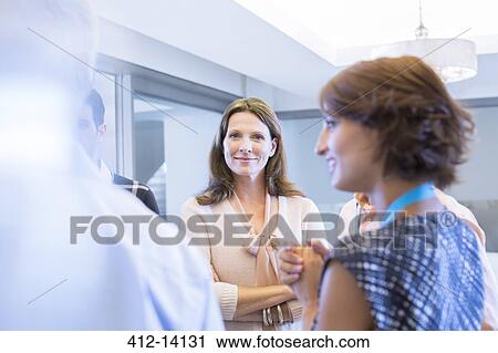 Business people talking in office View Large Photo Image Stock Image - Business people talking in office. Fotosearch
