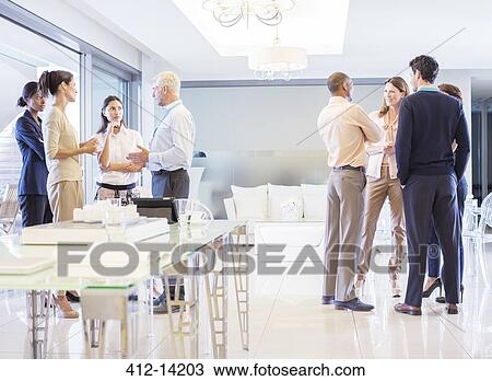 Business people talking in office View Large Photo Image Stock Image - Business people talking in office. Fotosearch