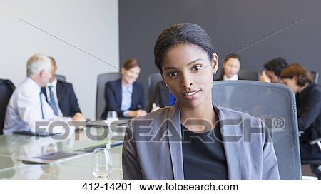 Business woman sitting in meeting View Large Photo Image Stock Image - Business woman sitting in meeting. Fotosearch