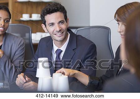 Businessman talking in meeting View Large Photo Image Stock Photo - Businessman talking in meeting. Fotosearch