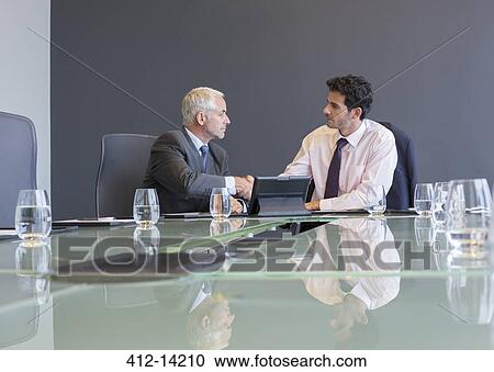 Businessmen shaking hands in meeting View Large Photo Image Stock Image - Businessmen shaking hands in meeting. Fotosearch