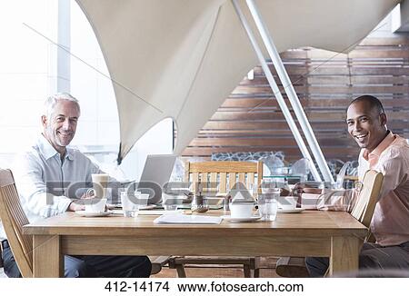 Businessmen working in office View Large Photo Image Picture - Businessmen working in office. Fotosearch