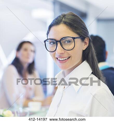 Stock Photo - Businesswoman smiling in meeting. Fotosearch