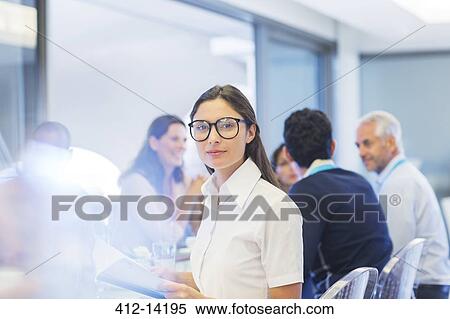 Businesswoman smiling in meeting View Large Photo Image Stock Photography - Businesswoman smiling in meeting. Fotosearch