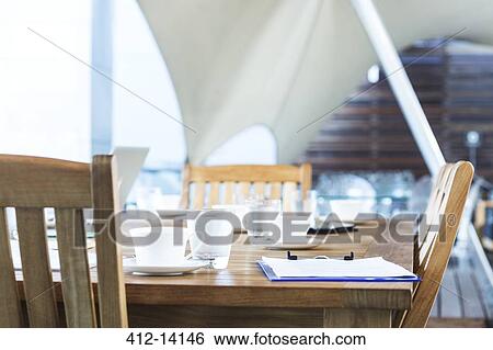 Stock Photograph - Chairs and table in empty conference room. Fotosearch