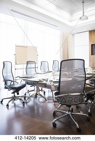 Stock Photography - Chairs and table in empty conference room. Fotosearch