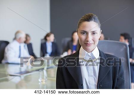 Confident businesswoman in meeting View Large Photo Image Stock Image - Confident businesswoman in meeting. Fotosearch
