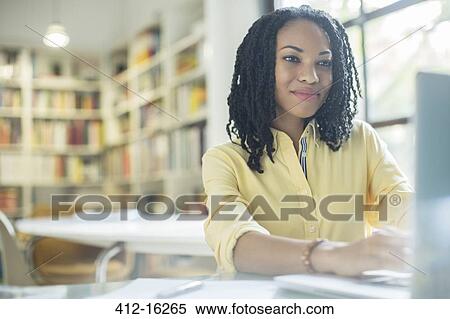 Businesswoman working at laptop View Large Photo Image Stock Photography - Businesswoman working at laptop. Fotosearch
